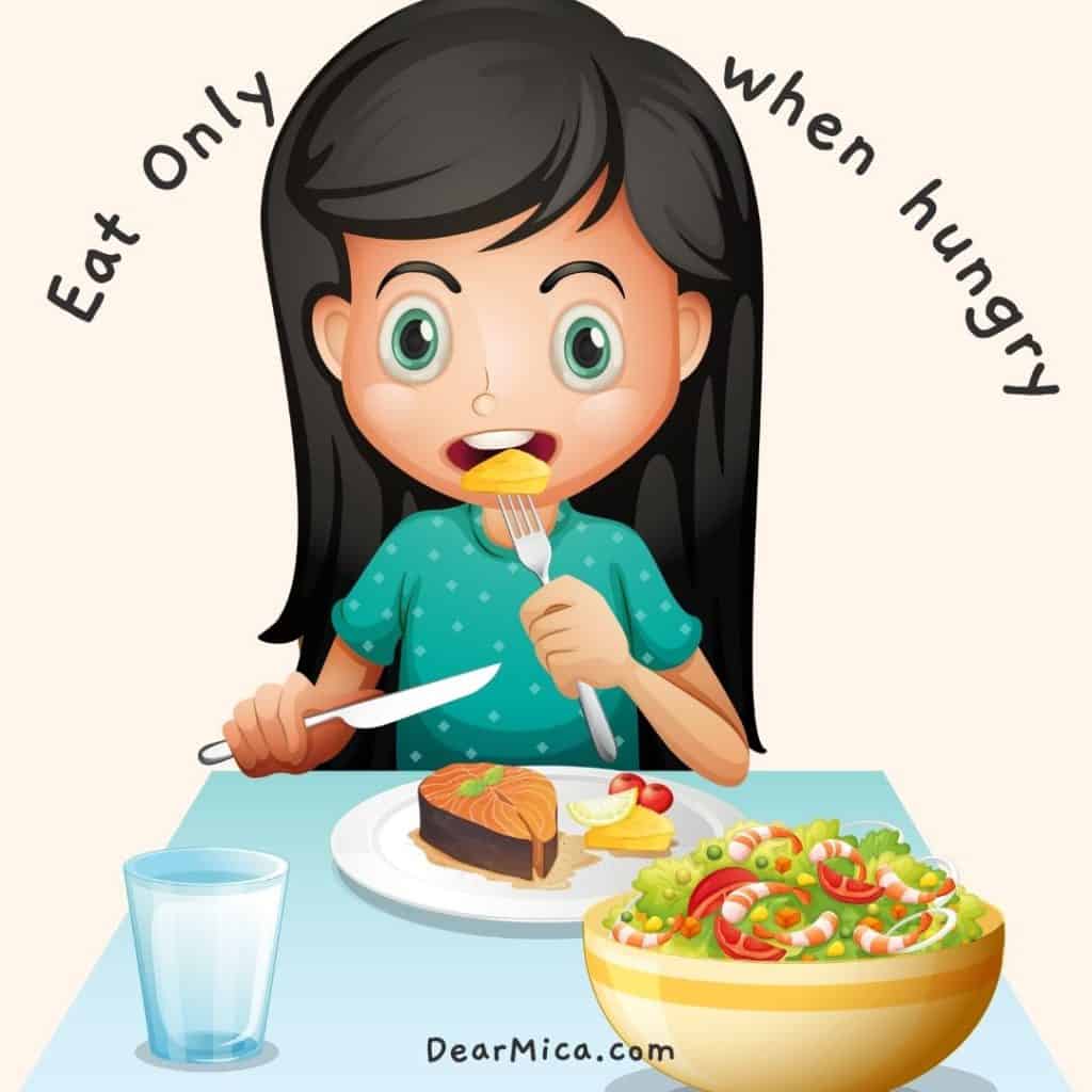 Girl eating keto diet, with writing saying Eat only when hungry