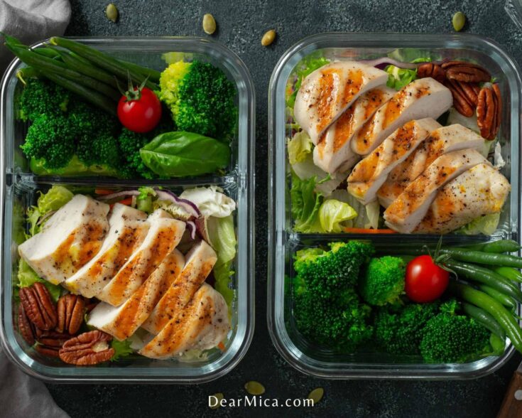Two Keto Meal Prep containers with green beans, grilled chicken breast, steamed broccoli served on a bed of romaine lettuce.