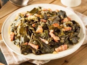 Plate of southern collard greens with bacon. What To Serve With Keto Collard Greens.